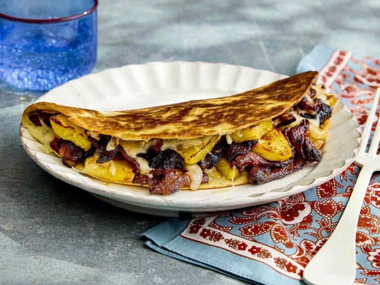 These gringas—crispy Mexican quesadillas filled with al pastor pork, charred pineapple, and melted cheese—are easy to make at home in a skillet, no trompo required. 