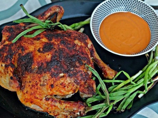 Few things in life are more satisfying than roast chicken. And when your bird is slathered with spicy, citrusy pimentón rub and served with tangy romesco? Resistance is futile.