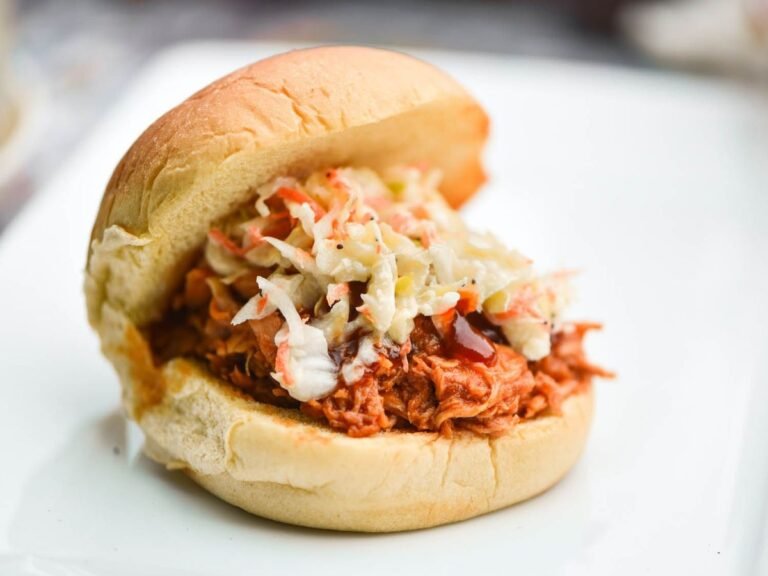 Smoky, juicy, tender, and flavored with a carefully calibrated homemade sauce, this pulled barbecue chicken is way better than just about any version we’ve ever had before