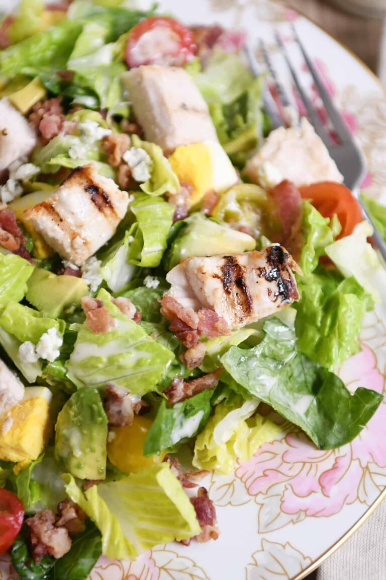 Light and healthy, this grilled chicken Cobb salad is packed with yummy ingredients (bacon, tomatoes, lettuce, cheese!) with a homemade dressing that is simple and tasty!